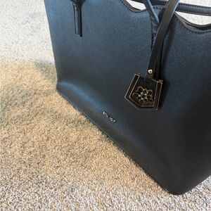 Elegant Black Tote Bag with Floral Charm